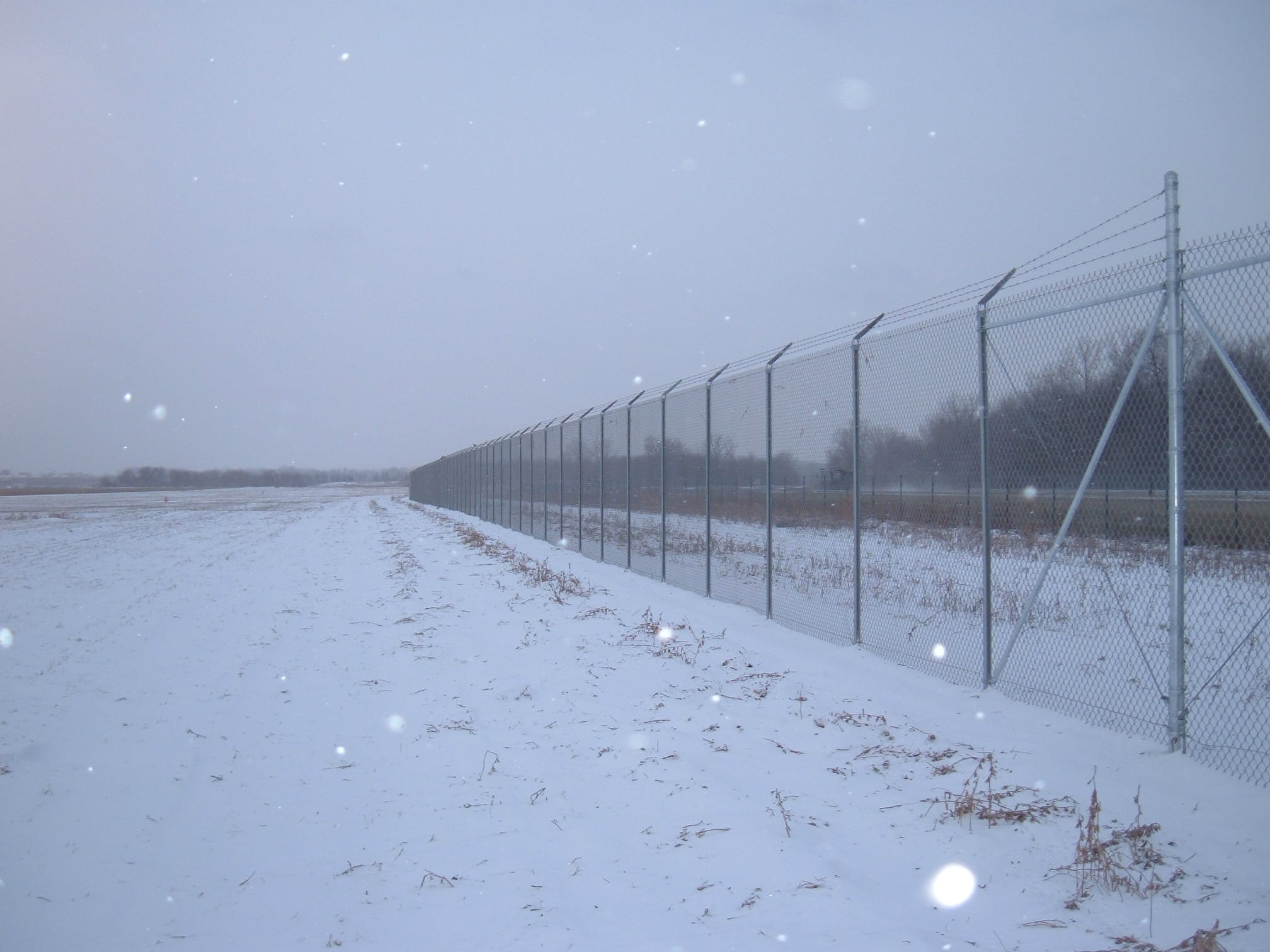 Image of commercial chain link security fencing at Willow Run Airport