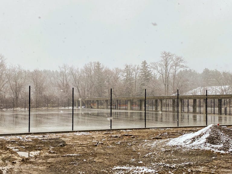 Image of new commercial tennis courts with chain link fencing and posts at Cranbrook Schools