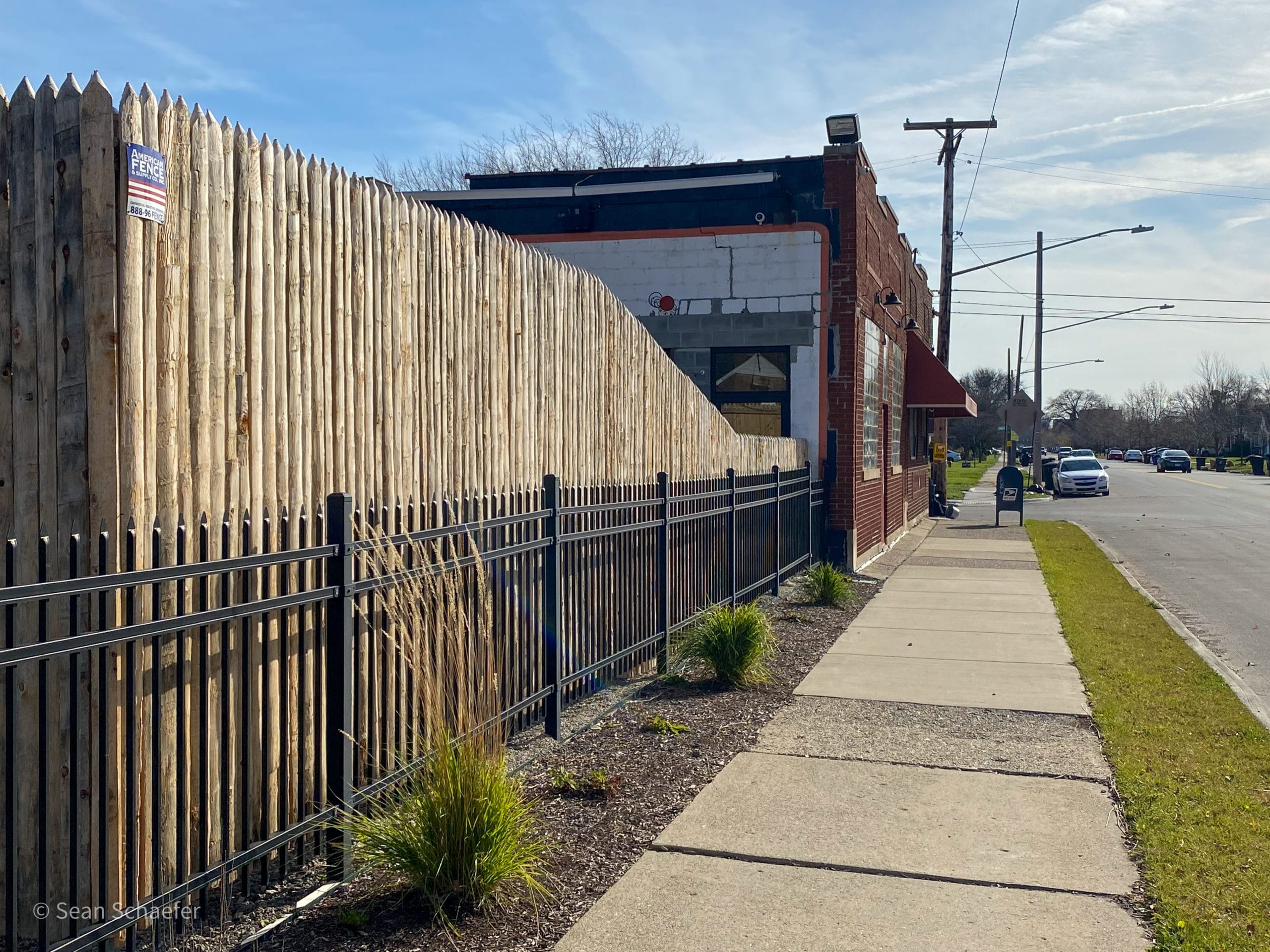 Image of commercial wood stockade patio fencing at Cadieux Cafe