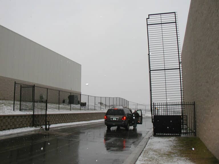 Image of commercial steel picket vertical pivot gate at Faurecia North America Headquarters