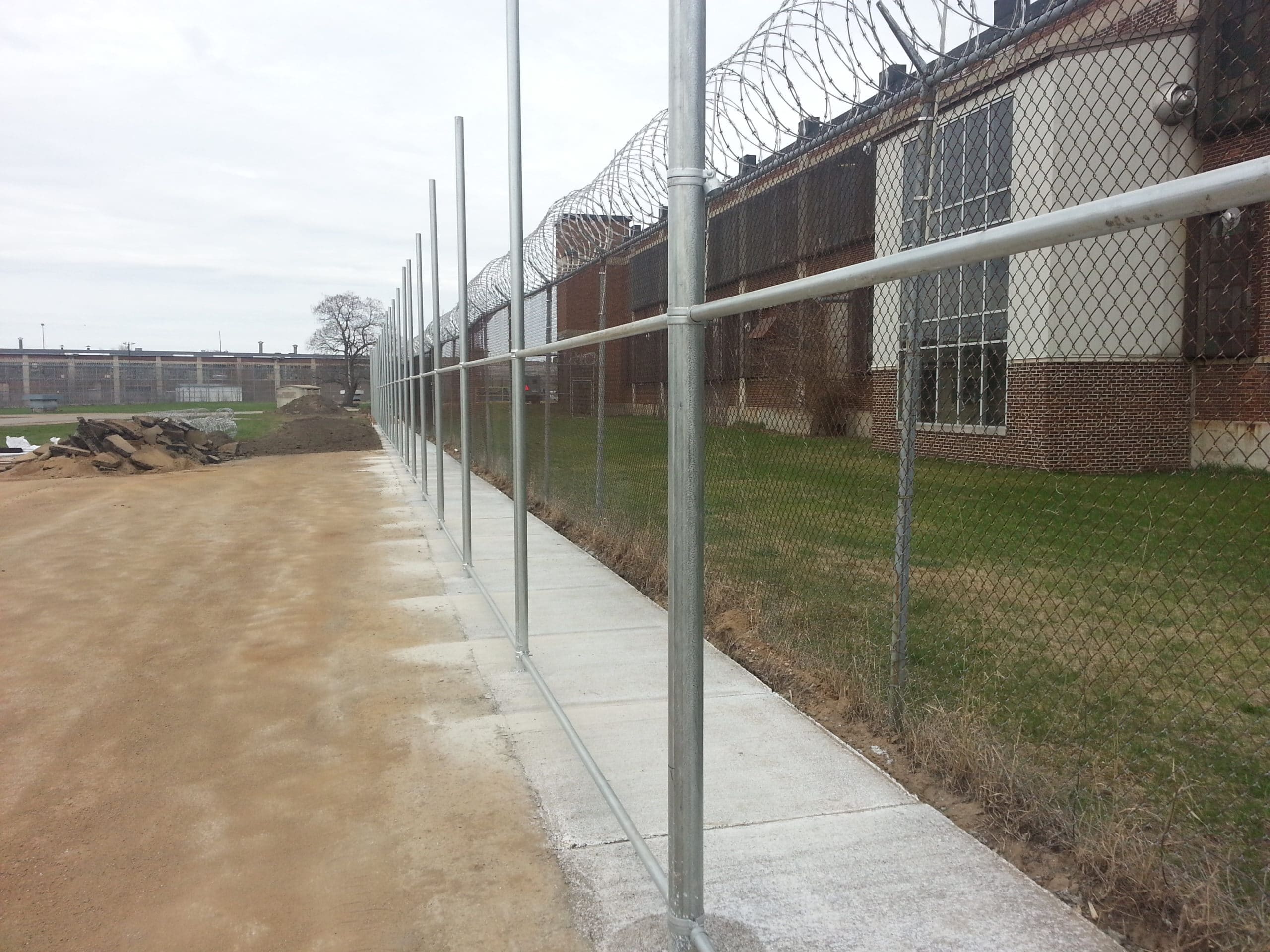 Image of razor ribbon and commercial chain link security fencing at Parnall Correctional Facility