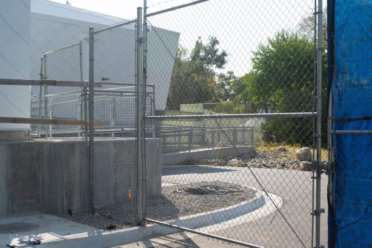 Image of galvanized steel chain link construction temporary fencing and swing gate at Detroit Zoological Society