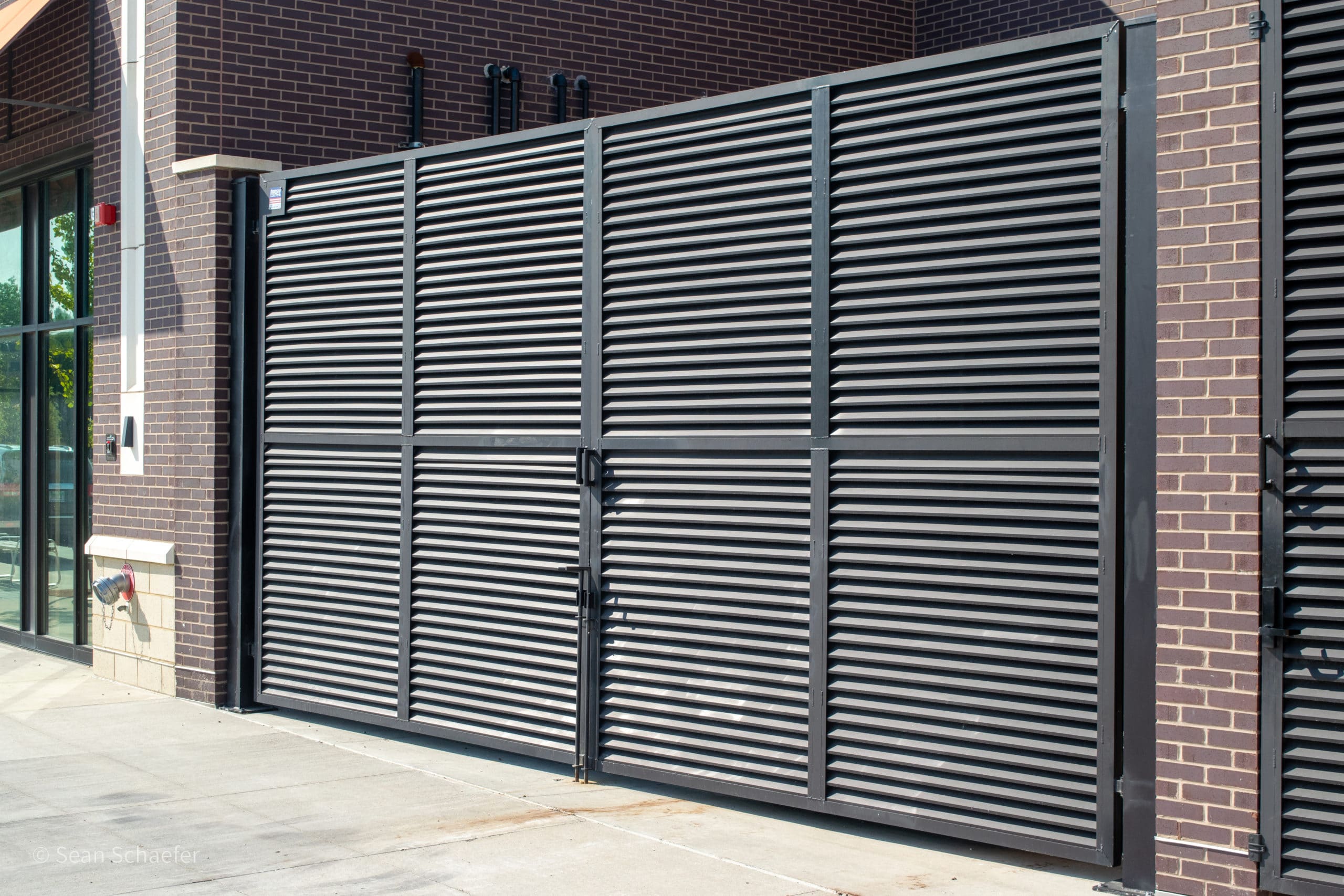 Image of commercial AmeriLouver® dumpster gates at Woodward Corners by Beaumont