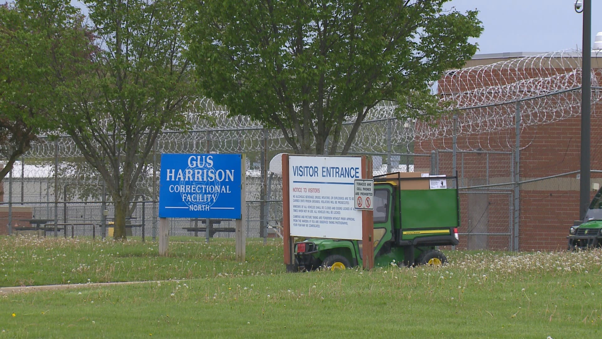 Image of commercial chain link fencing, barbed wire, and security lighting at Gus Harrison Correctional Facility