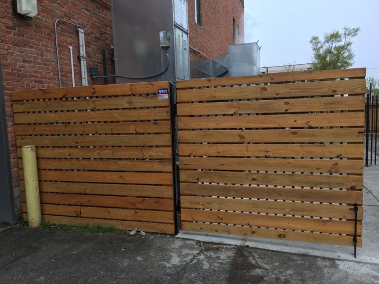 Image of commercial wood and steel dumpster enclosure and gates at Elton Park Corktown