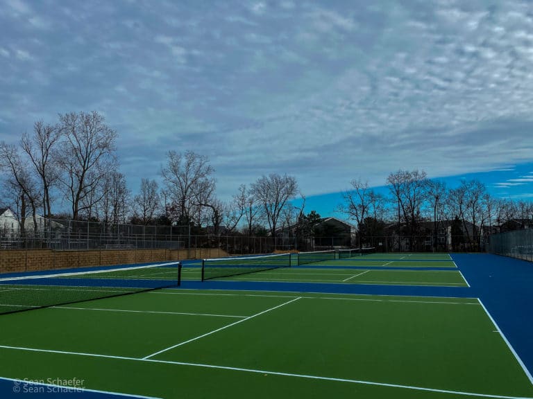 Image of new pickle ball courts, commercial chain link fencing, nets, and posts in Metro Detroit, Michigan