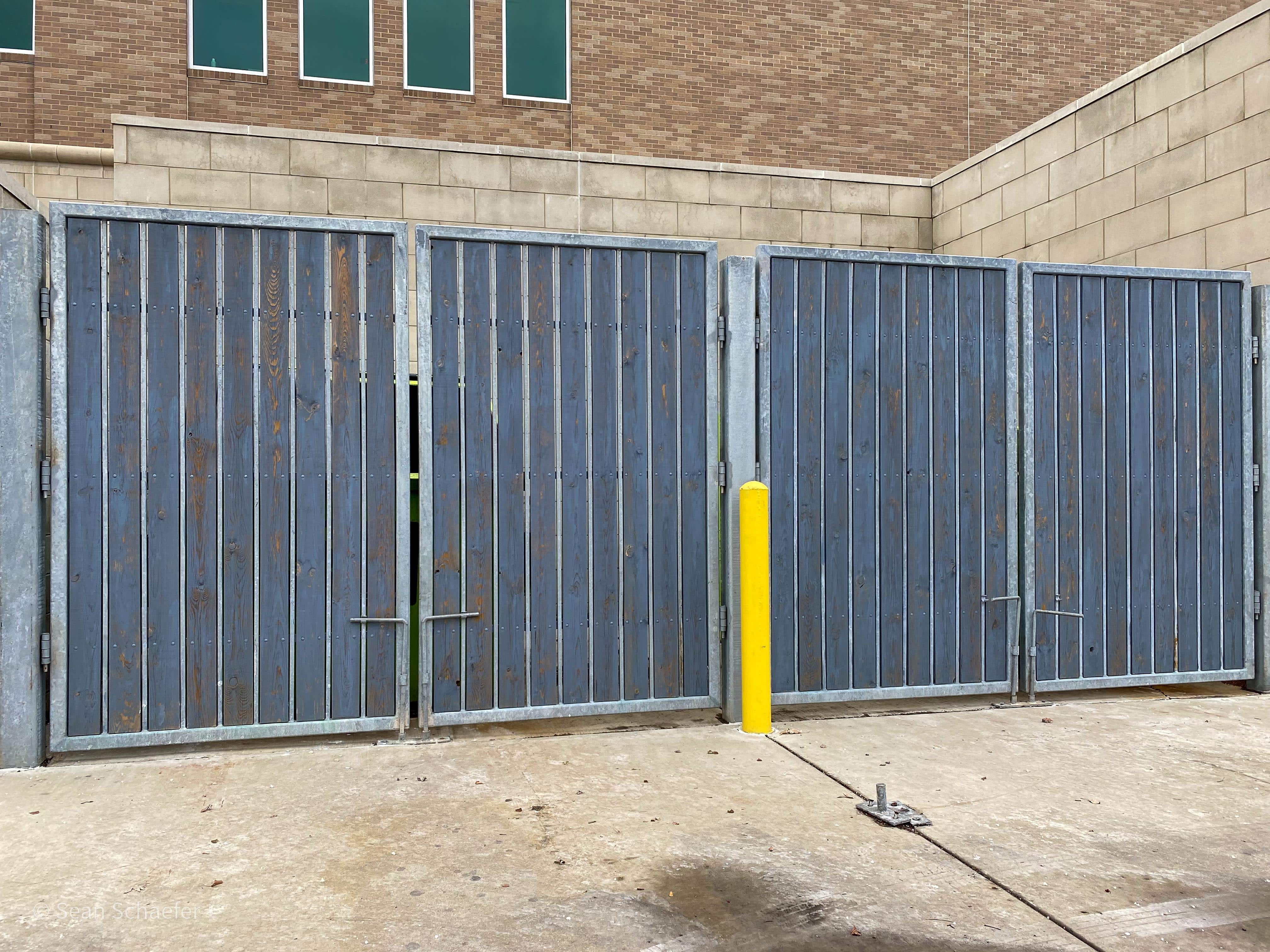 Image of wood and steel commercial dumpster gates in Metro Detroit, Michigan