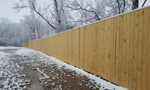 Background image of commercial wood privacy fencing in Metro Detroit, Michigan